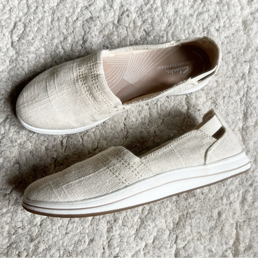 Cloudsteppers by Clarks Breeze Vibe: Metallic Silver Thread Cream Slip-On Flats